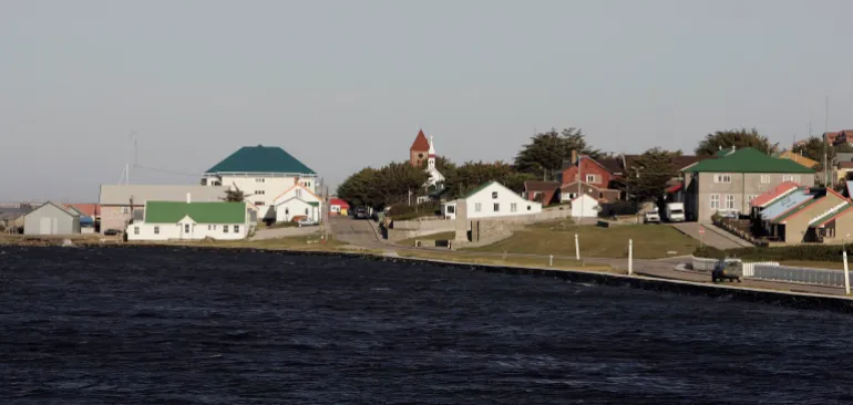STANLEY, FALKLAND ISLANDS - FEBRUARY 02: A landrover drives along the sea front on February 2, 2007 in Stanley, Falkland Islands. The United Kingdom will commemorate 25 years since the 1982 Argentine invasion of the Falkland Islands with ceremonies throughout the year. (Photo by Peter Macdiarmid/Getty Images)