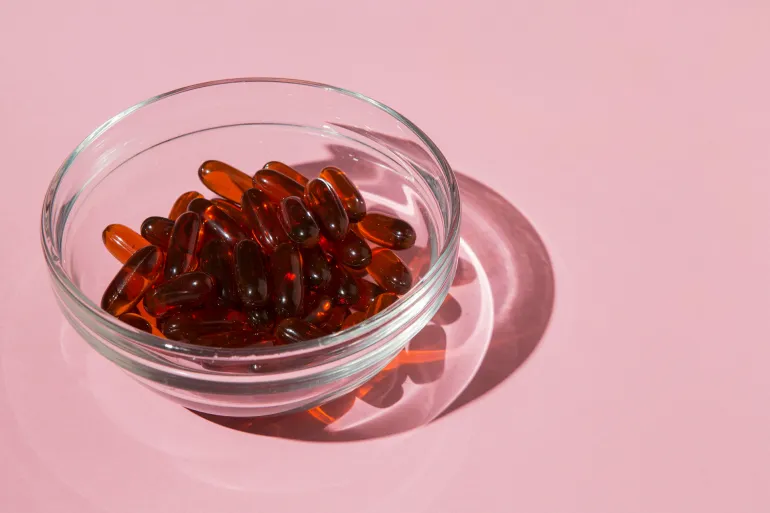 Bowl filled with medical capsules @فري بيك