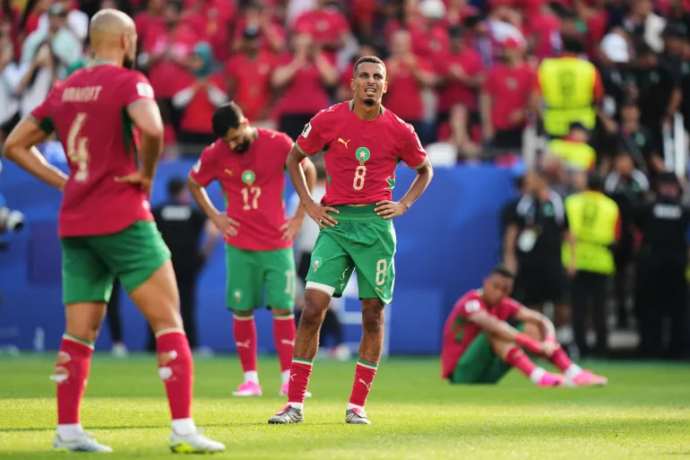Morocco's Azzedine Ounahi (8), Abde Ezzalzouli (17), Sofyan Amrabat (4) and others react at the end of the match during the World Cup quarterfinal soccer match between France and Morocco in Foxborough, Mass., near Boston, Thursday, July 9, 2026. (AP Photo/Stephanie Scarbrough)